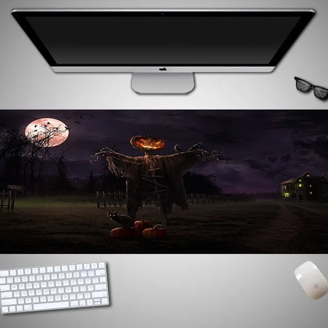 Large Halloween patterned gaming mouse pad on a desk showing non-slip rubber base and extra-long design.