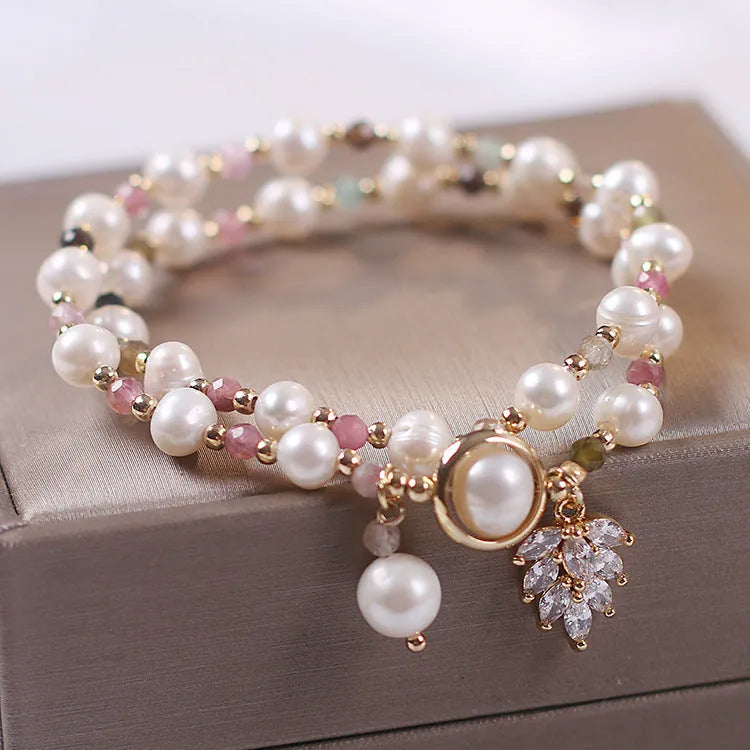 Women's double layer crystal bracelet with lucky cat charm and red cat's eye flowers in ethnic fairy style.