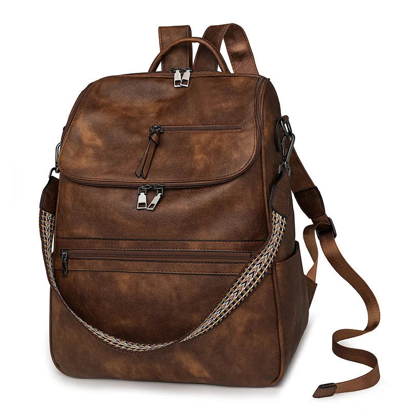 Retro solid colour PU backpack with curved shoulder straps shown in black.