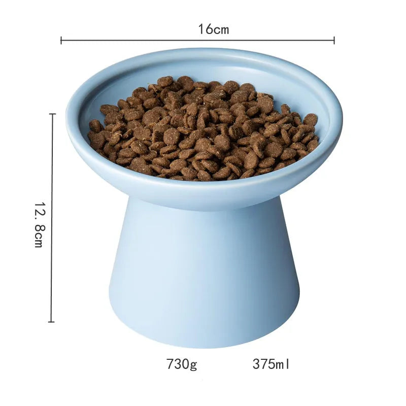 Ceramic elevated cat food bowl in blue colour with wide shallow design and raised base