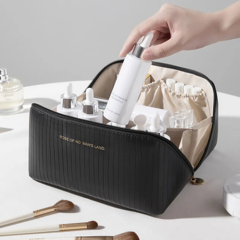 Vertical pattern pillow makeup bag in beige, black, brown, grey, or pink, showing cubic 22.5cm shape.