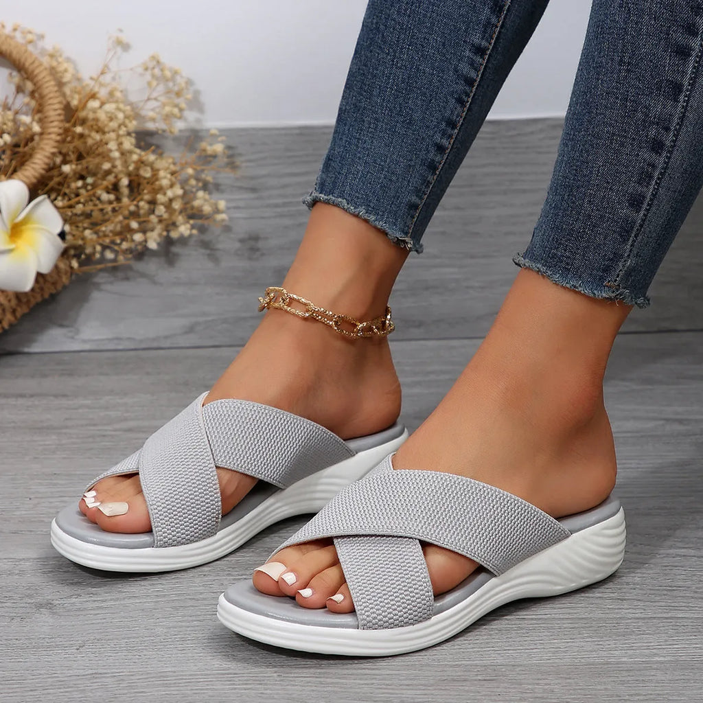 Black romantic style women's wedge slippers with cross strap and thick rubber sole