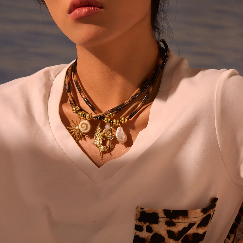 Geometric leopard head stainless steel necklace with gold electroplated finish on adjustable chain