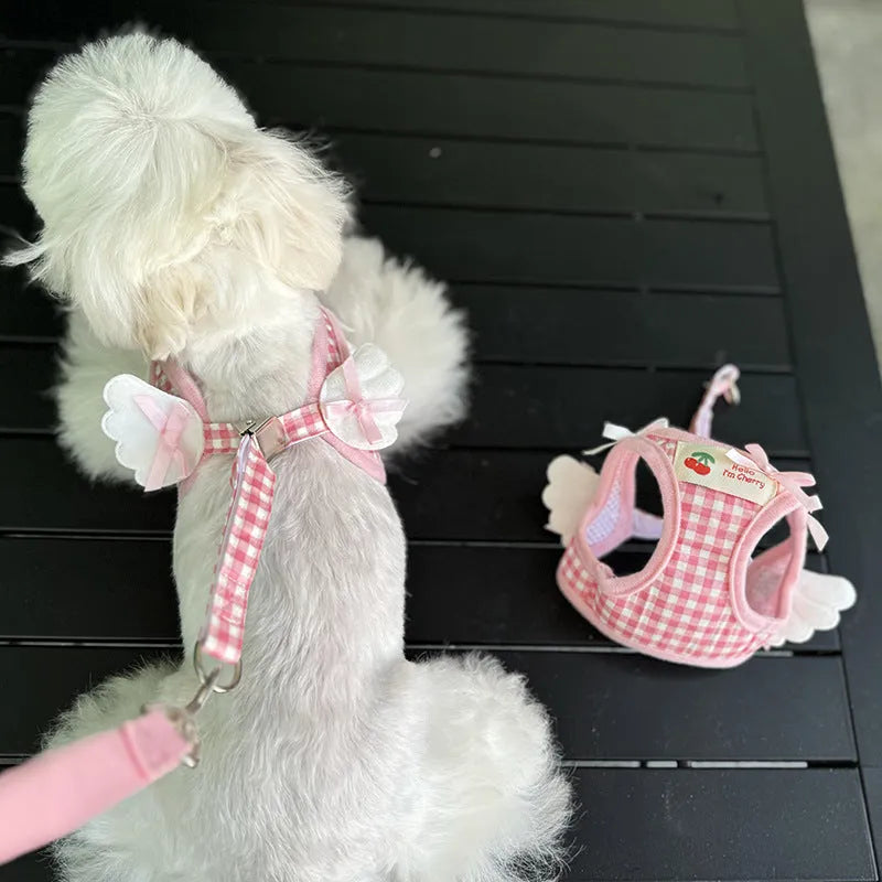Soft cotton chest and back harness for a small dog, with hand-holding rope, shown in pink colour.