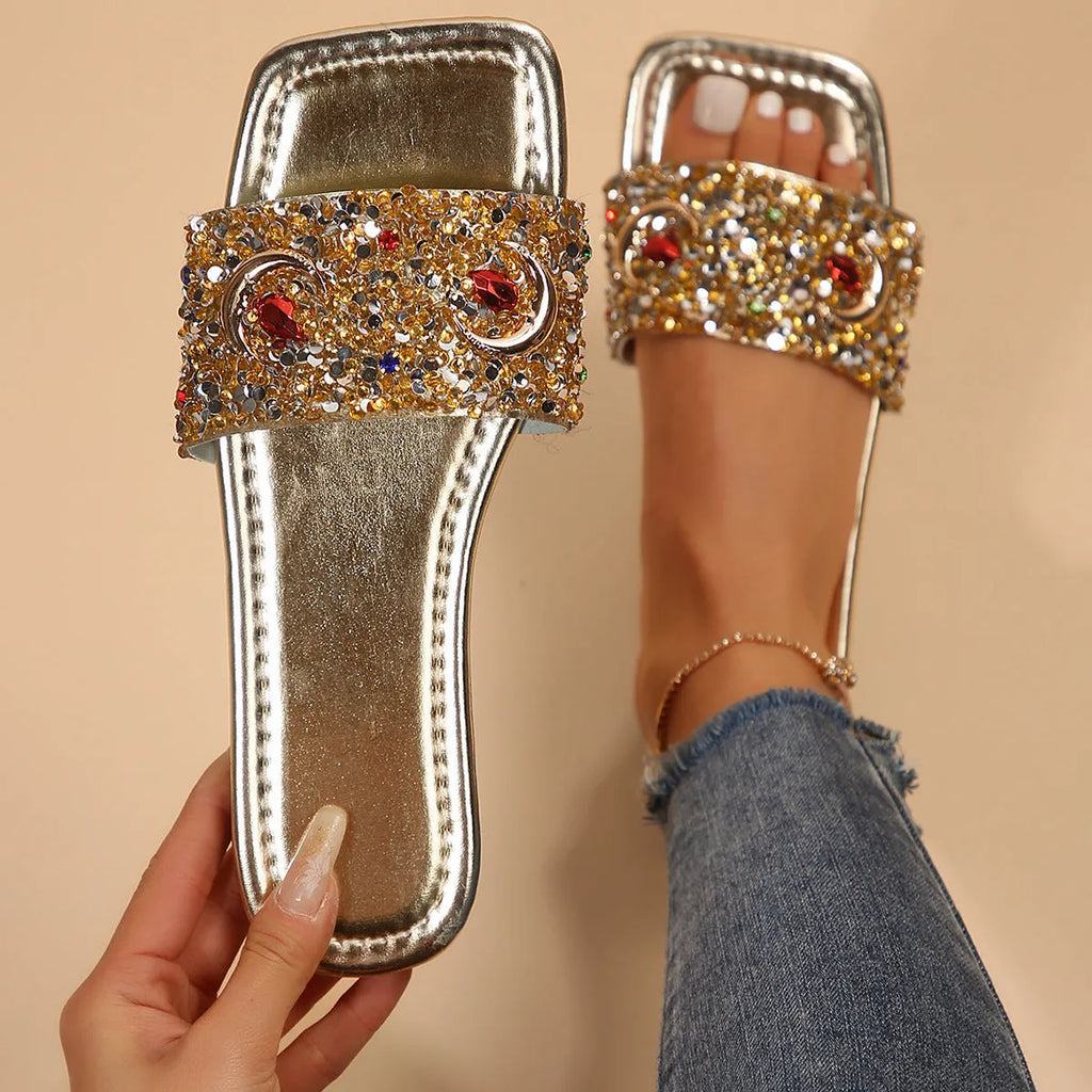 Gold women's flat slippers with rhinestone sequin decoration on the upper.