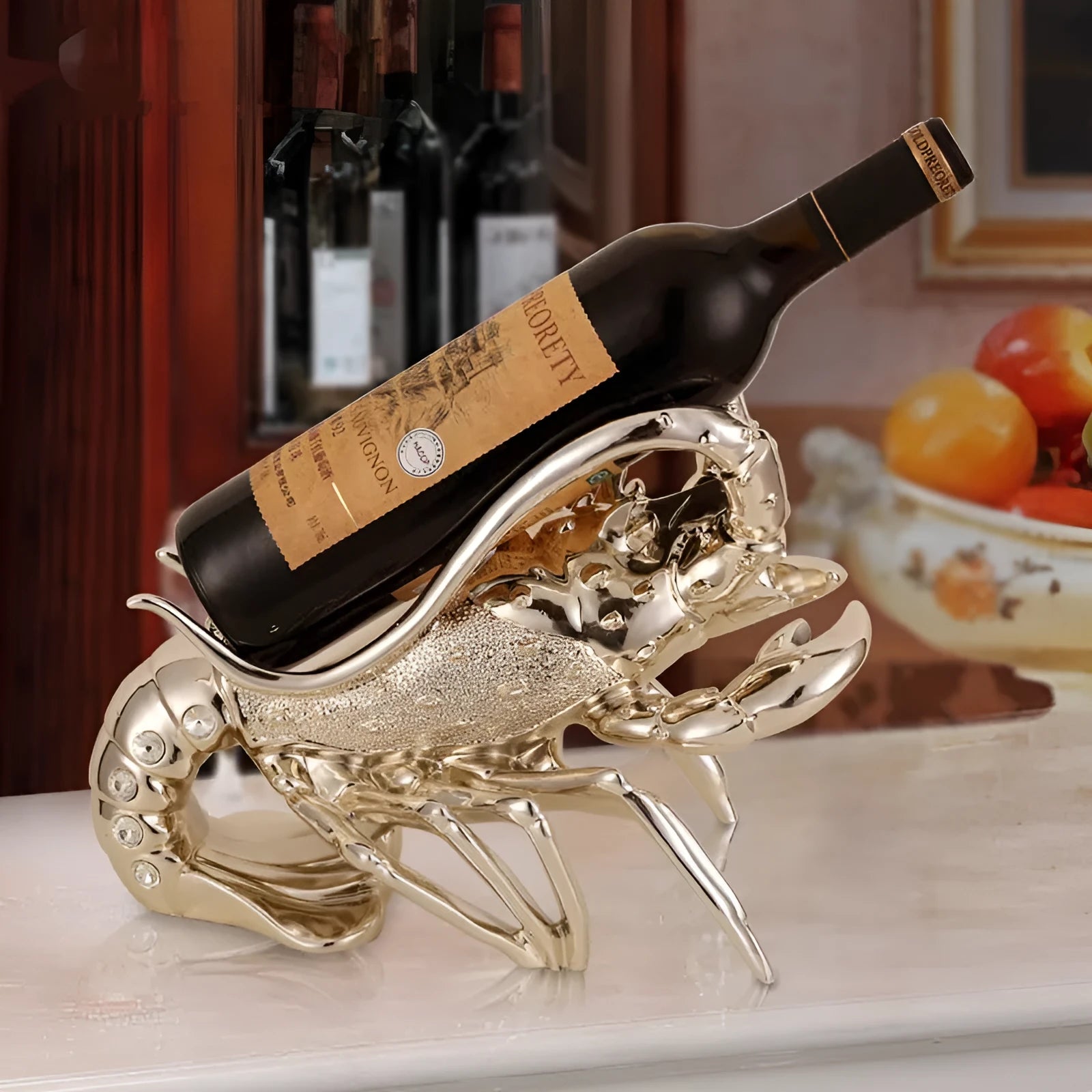 Lobster-shaped decorative wine rack ornament in rose gold or silver finish on a tabletop.