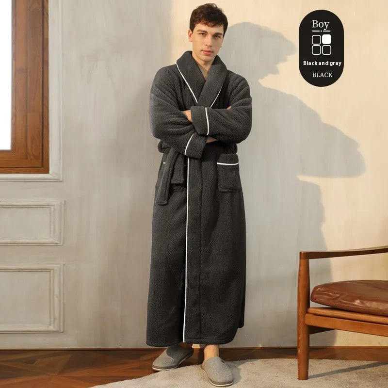 A man and woman wearing matching thick, navy blue flannel bathrobes in a European style cut.