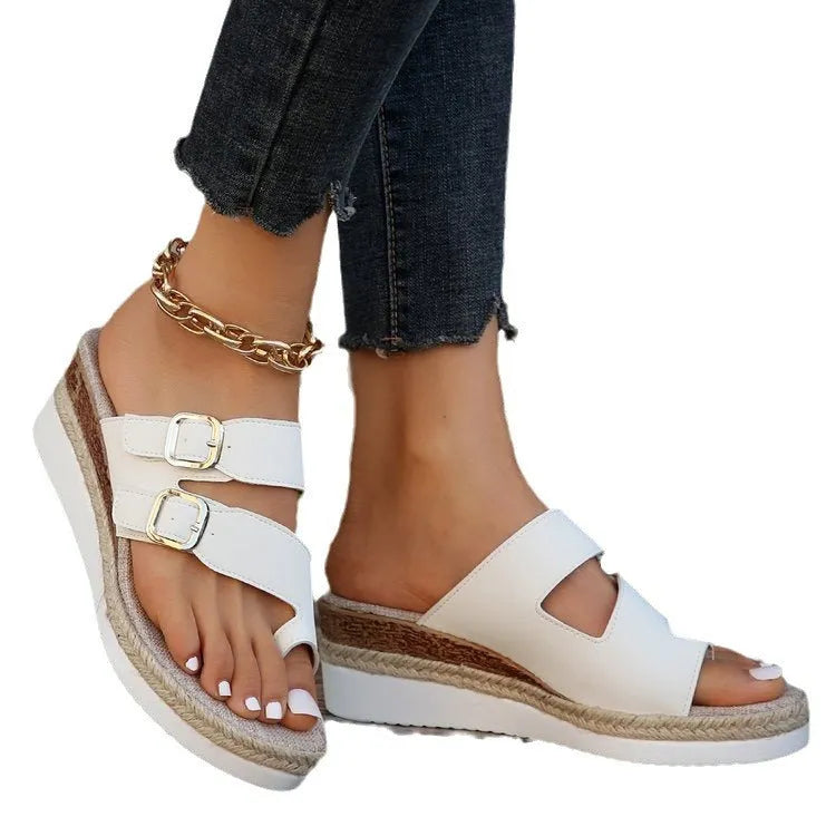 White patent leather wedge sandals with finger fit design and peep toe