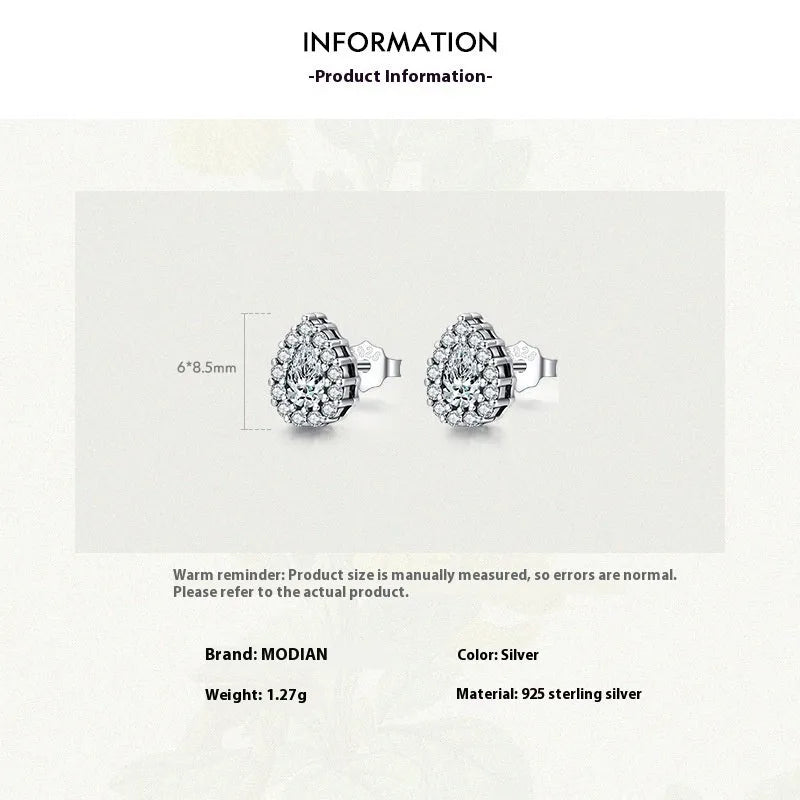 A pair of women's silver drop ear studs made from 925 sterling silver with a teardrop shape.