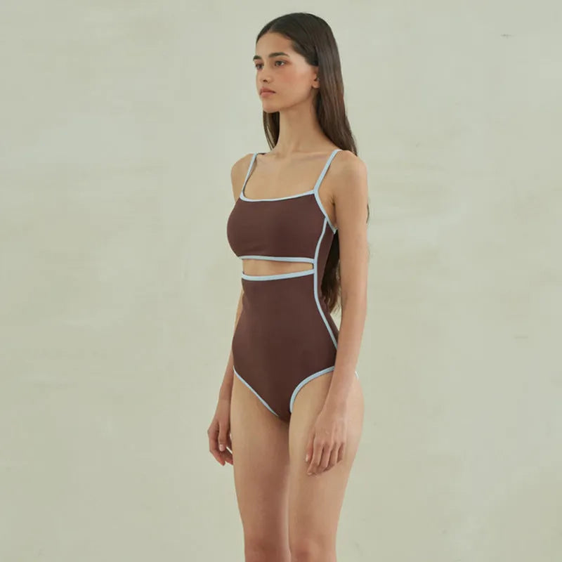 Brown women's one-piece triangle swimsuit made from nylon fabric on a mannequin.
