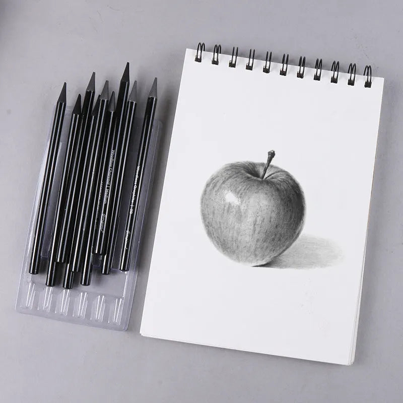 Set of six graphite and three carbonised art pencils in suction card packaging.