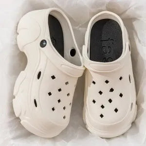 Men's summer outdoor EVA hole slippers in black with non-slip injection-moulded sole and closed toe cap