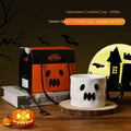 Orange and white Halloween pumpkin-shaped ceramic mug with handle on a table.