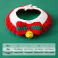 Hand-woven red and white Christmas bow knit collar scarf for a cat on a festive background.