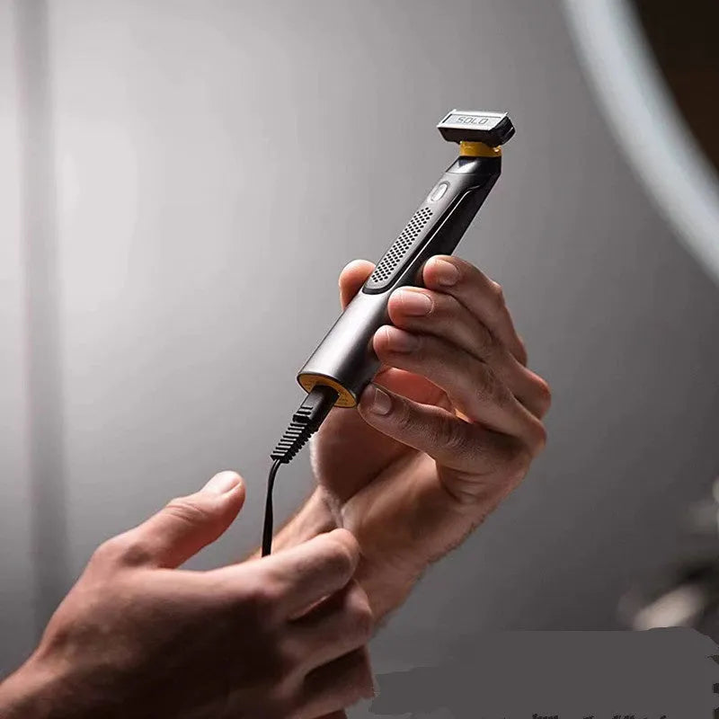 Black wireless rechargeable men's shaver with LED light on a compact stainless steel blade head