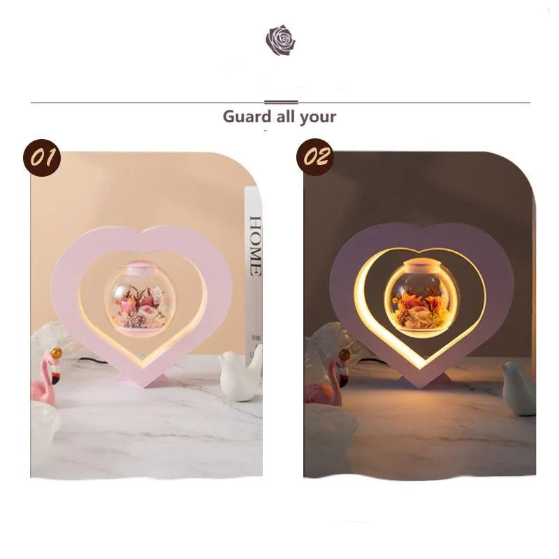 Pink preserved rose ornament with LED lights on a base, with optional audio Bluetooth for music.