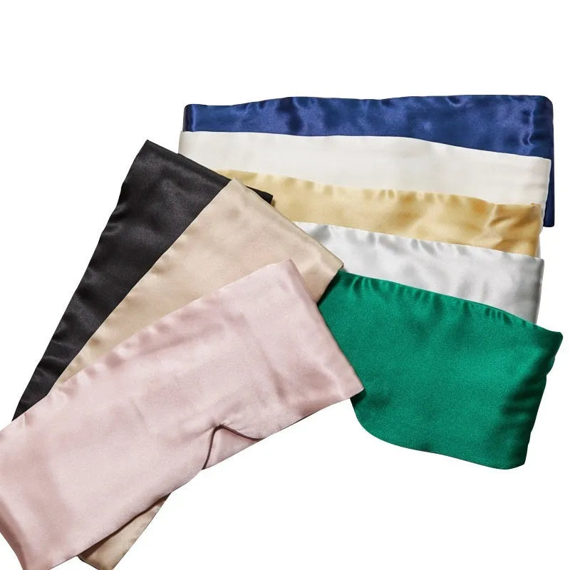 Mulberry silk sleep eye mask shown in one of seven colours: black, gold, blue, gray, white, pink, or green.