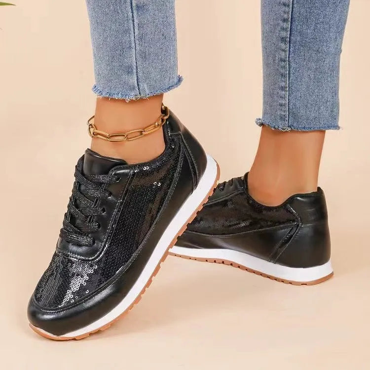 Women's black thick-soled casual sneaker with square toe and PU leather upper.