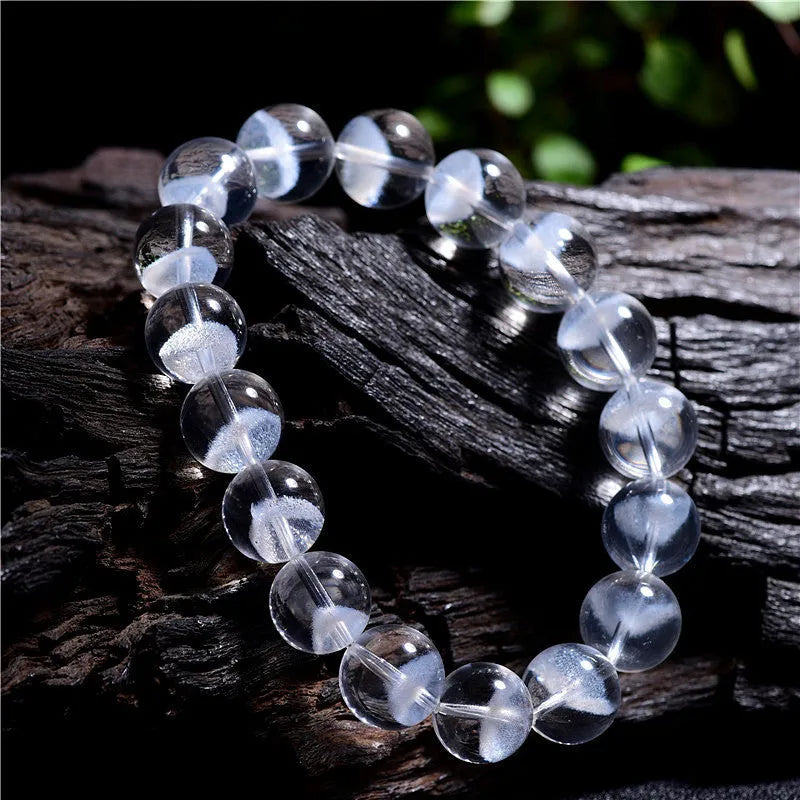 Women's original white crystal pyramid bracelet with ruyi charm, showing polished beads.