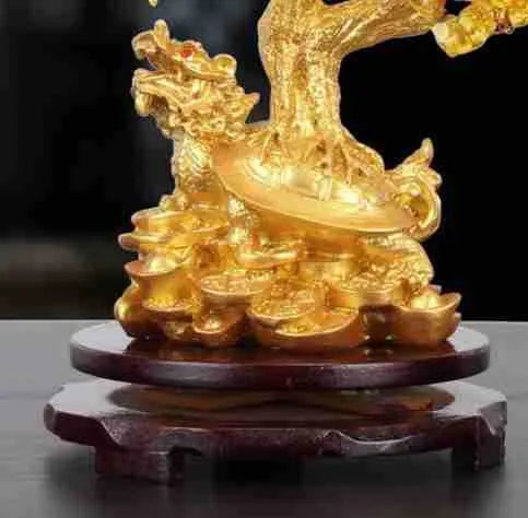 Citrine coloured resin money tree ornament with small water turtle model in Chinese style.