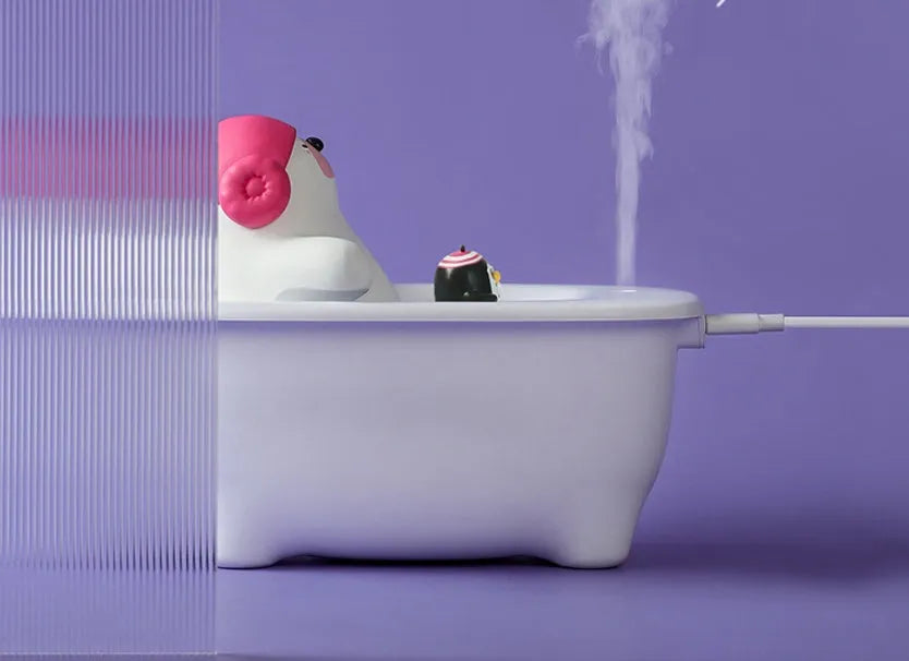 White creative USB air humidifier with large water tank on a desk.
