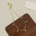 Women's zircon jewellery set showing necklace, earrings, and anklet with geometric meteor shower design.