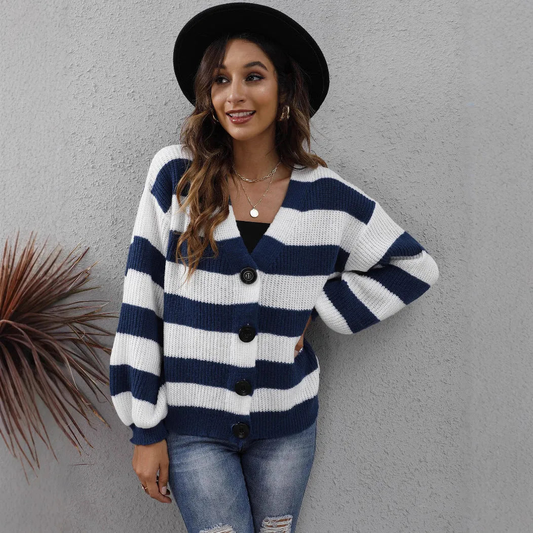 Women's striped cardigan sweater in deer plush fabric with button stitching.