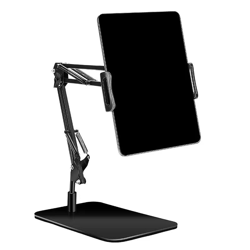 Black universal phone stand with long adjustable metal arm and heavy round base on a desk