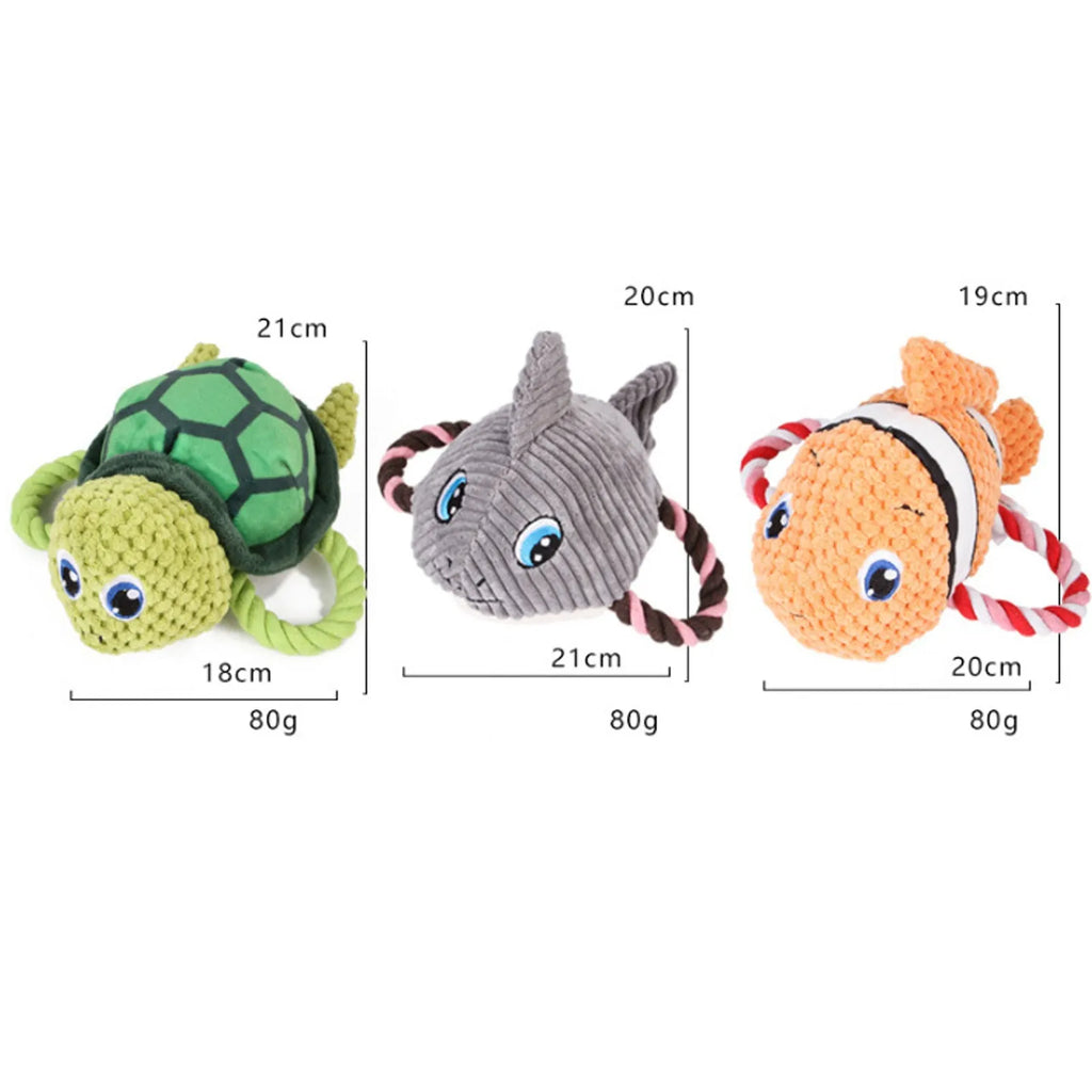 Turtle-shaped plush dog toy with knotted interior and squeaker in grey, green and orange colours