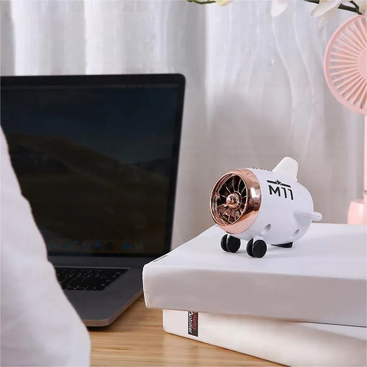 Mini wireless Bluetooth speaker in various colours showing compact 85mm × 75mm × 70mm design