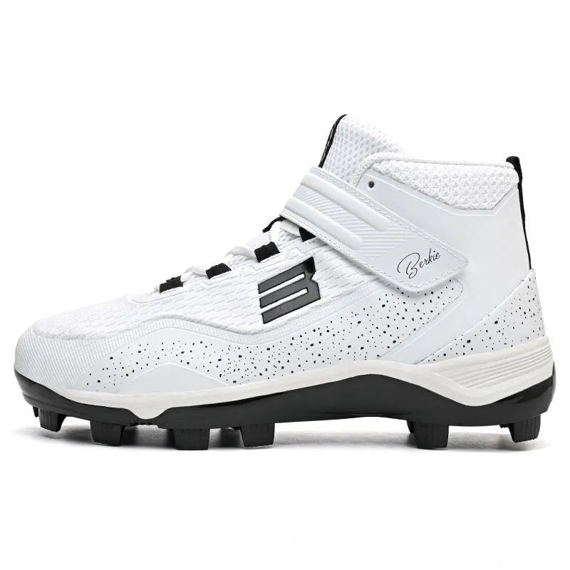 Black and white middle top baseball shoes with Velcro straps and a rubber sole.