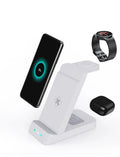 Black and white 3-in-1 wireless charging station with phone stand, showing charging areas for phone, watch, and earbuds.