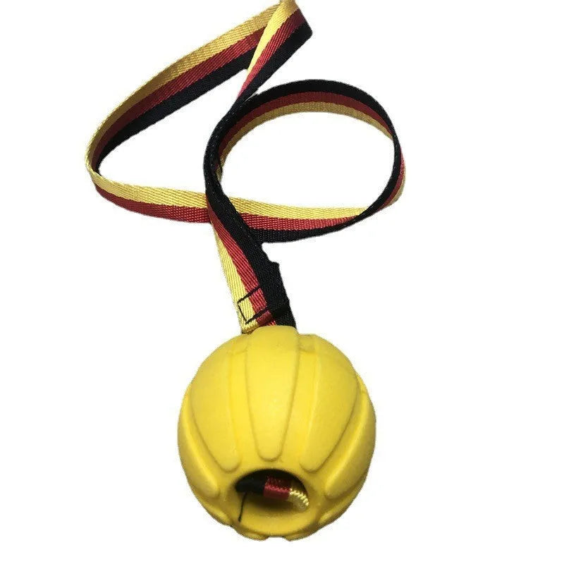 Yellow EVA floating tetherball for dog water training next to a camouflage-coloured ball.