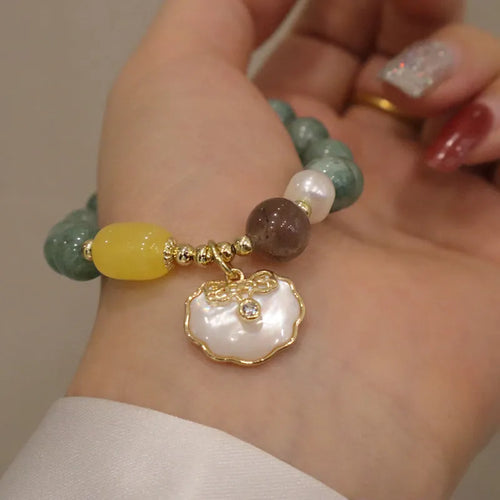 Women's green jade shell bracelet with adjustable fit in casual style
