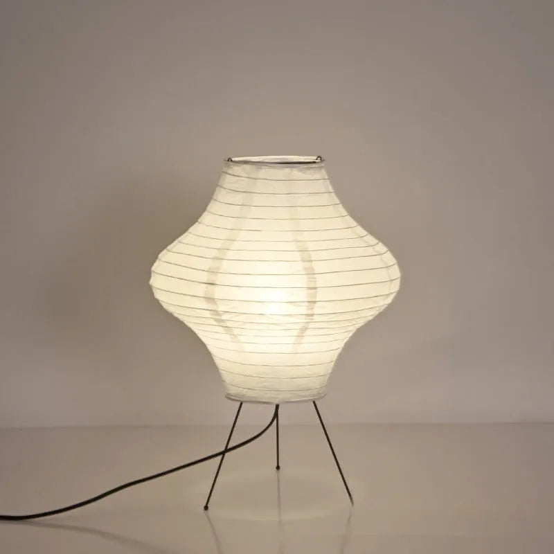 Silent Wind Japanese style Xuan paper table lamp with soft white glow on a wooden table.