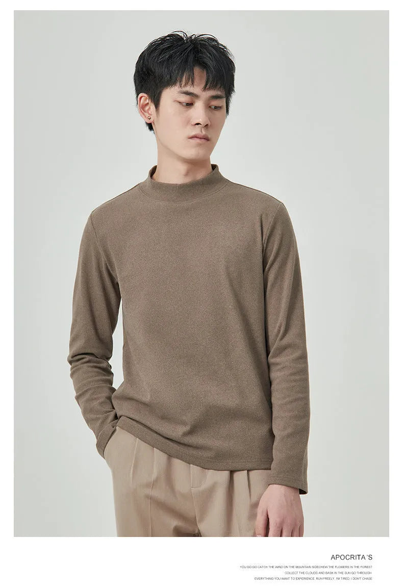 Man wearing a brown Dralon half-high collar long sleeve t-shirt for casual autumn wear.