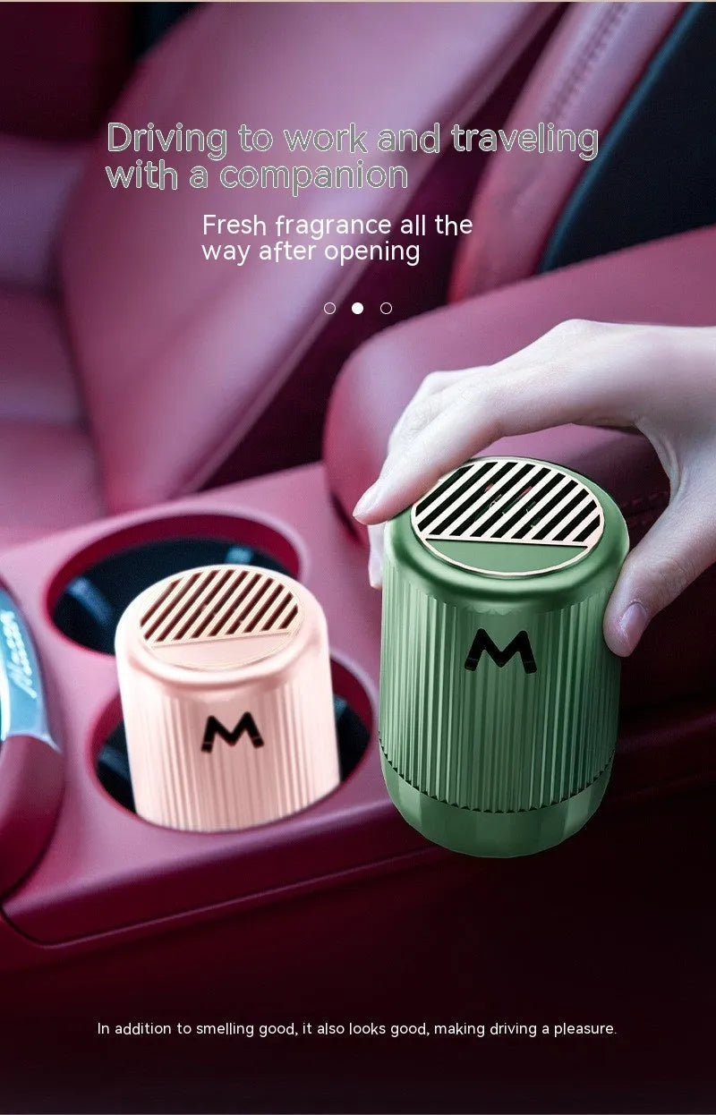 Solid car aromatherapy decorative cup in choice of four fragrances, measuring 10 by 6 centimetres.