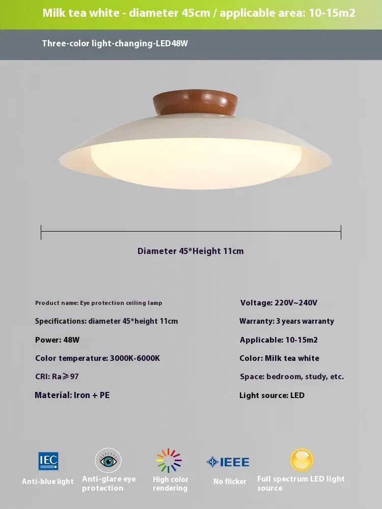Modern cream style flying saucer shaped ceiling lamp in an iron shade.