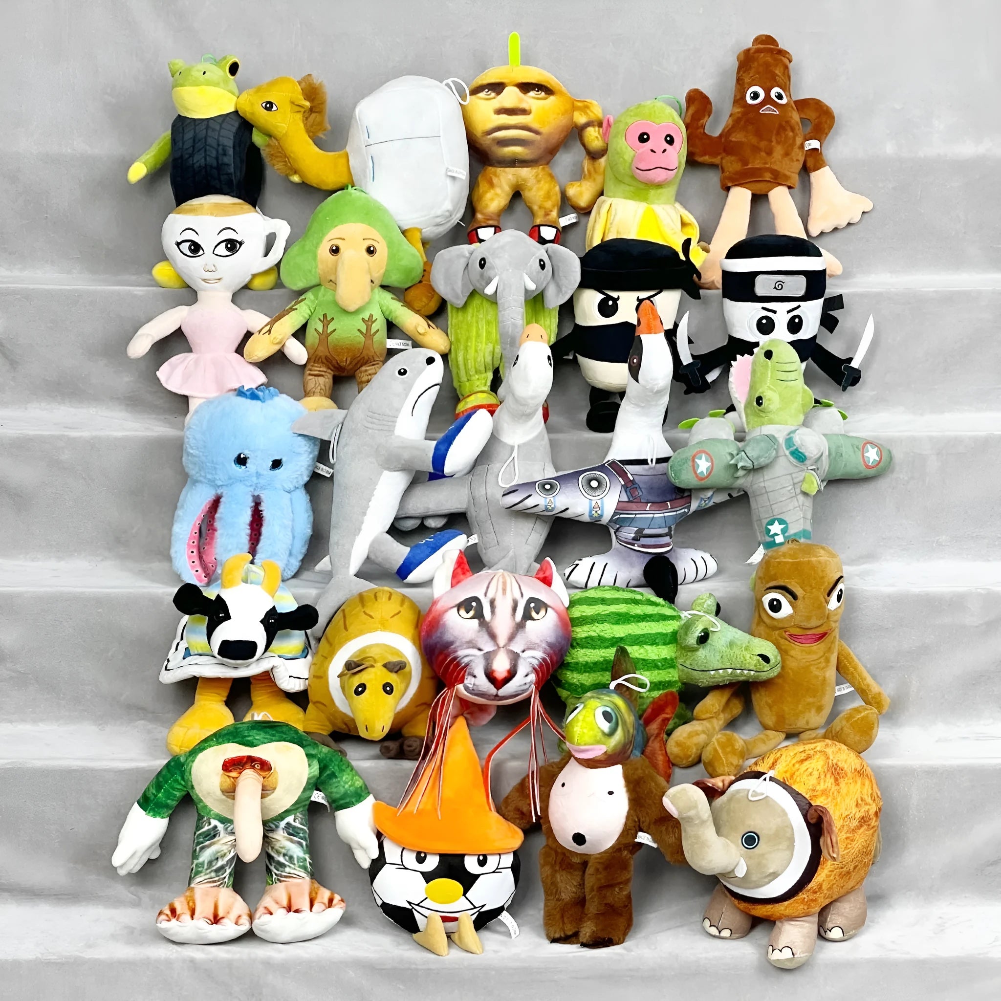 Shark figurine plush toys collection with 26 character designs including shark running shoes and orange muscle men