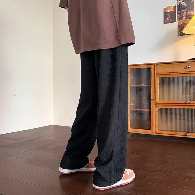 Men's jacquard rhombus draped pants in black, long straight-leg polyester blend trousers with non-ironing finish.