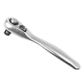 Silver galvanised steel mini ratchet wrench socket wrench on neutral background