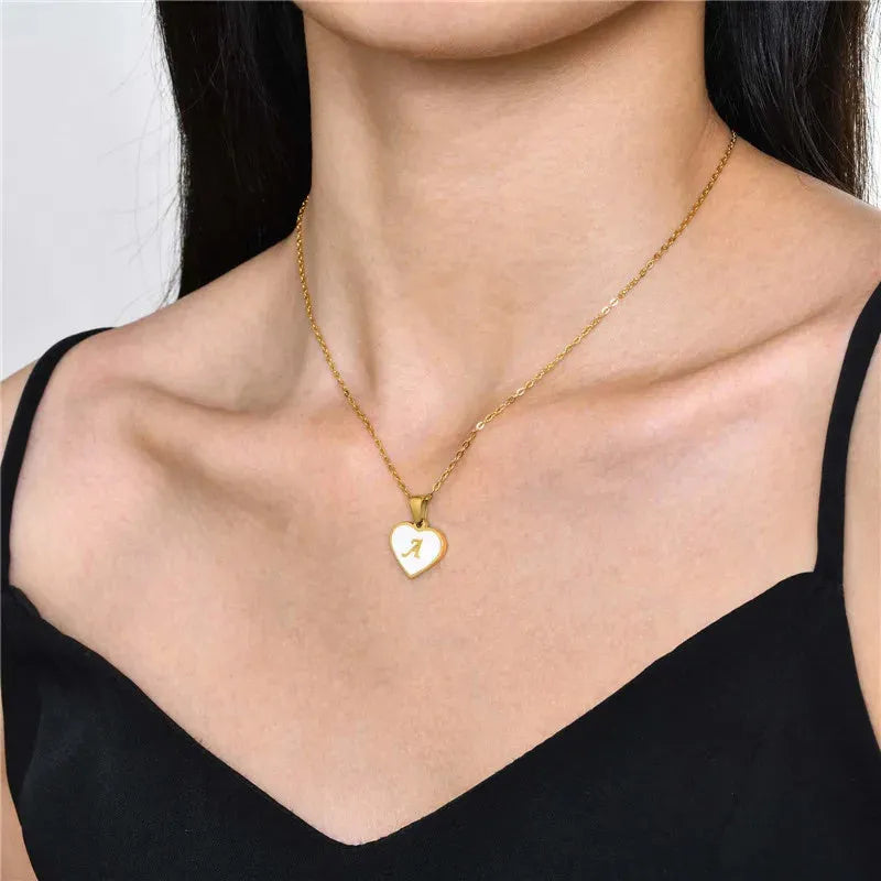 Gold-plated heart necklace with white shell centre and personalised letter pendant on 45cm chain