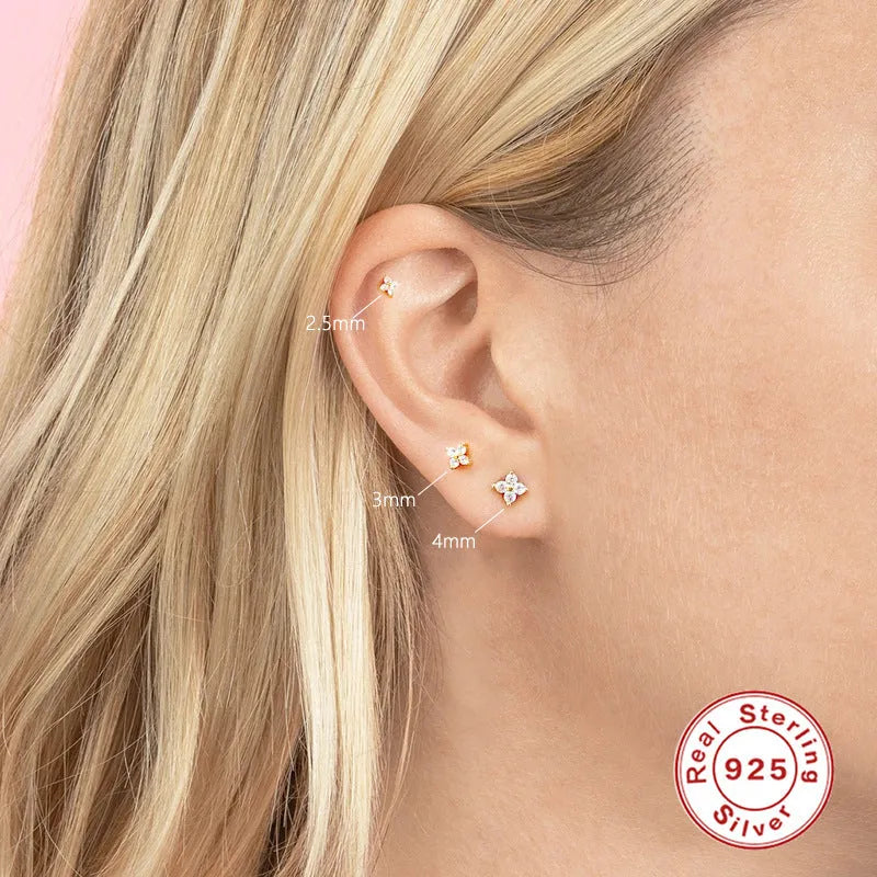 S925 sterling silver stud earrings with geometric petal and flower crystals in gold or platinum finish.