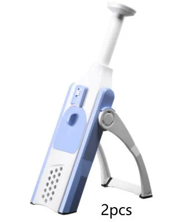 White and blue multifunctional vegetable slicer with stainless steel blades on a kitchen counter.
