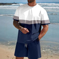 Man wearing a loose light blue short-sleeved t-shirt and matching shorts from a polyester summer set.