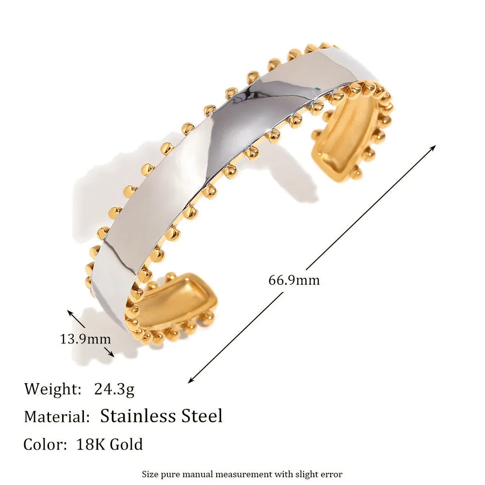 Gold geometric stainless steel jewellery set for women, showing earrings, necklace, and bracelet with electroplated finish.