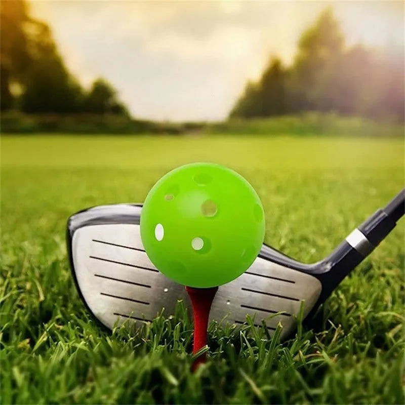Multi-coloured 42mm golf practice balls with dimpled design in a net bag.