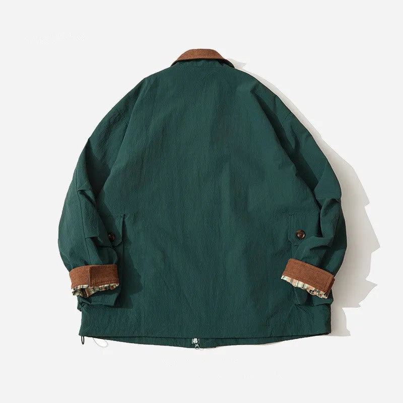 Casual apricot and green polyester jacket with side seam pockets on a hanger.