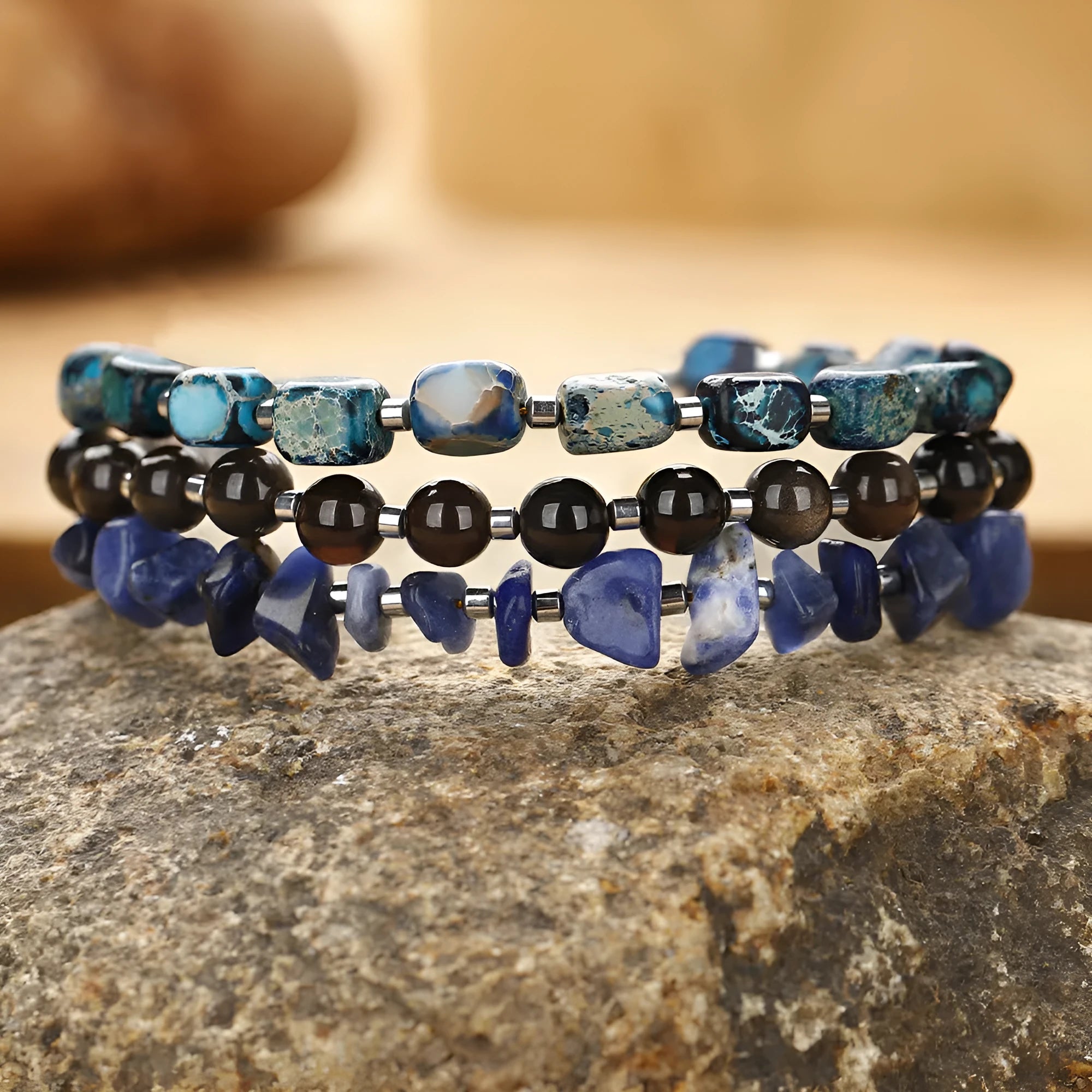 Blue hand-woven bracelet made from crushed Fang Hui stone and gold obsidian with geometric shapes