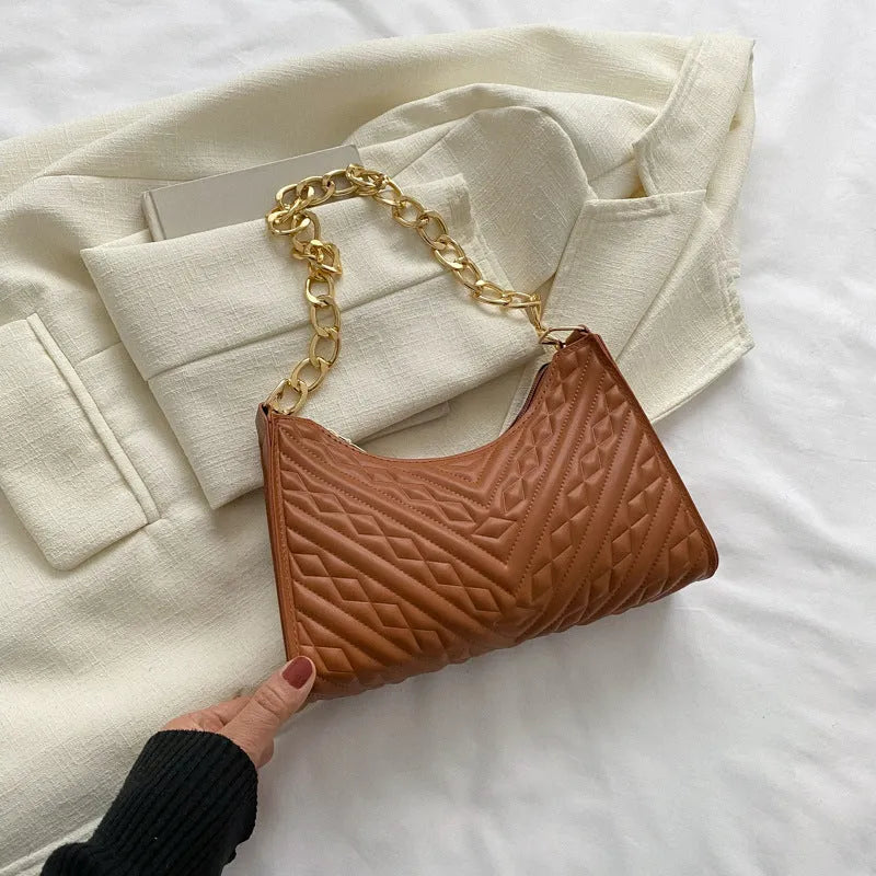Brown pleated PU chain baguette shoulder bag showing square shape and soft handles.